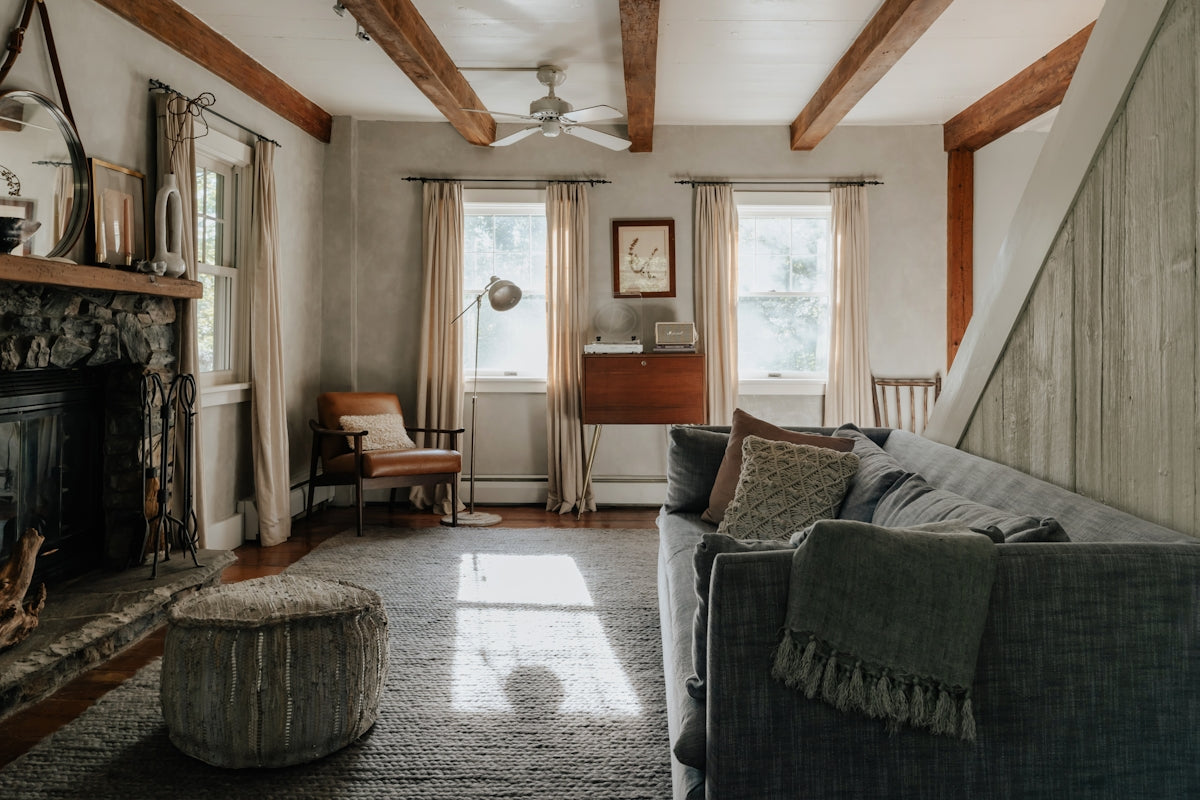A living room filled with furniture and a fire place