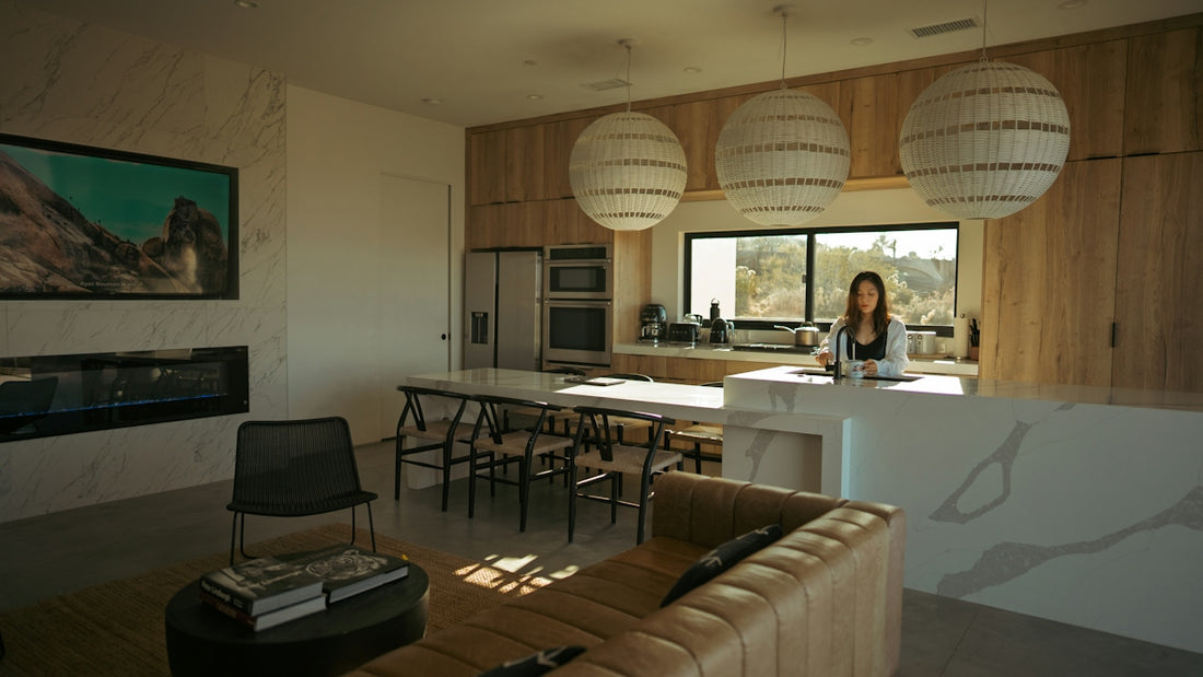 Woman standing in a modern kitchen and living area